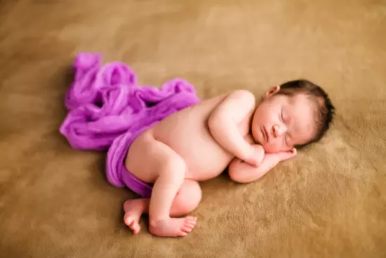 Newborn baby photographed in professional maine photography studio