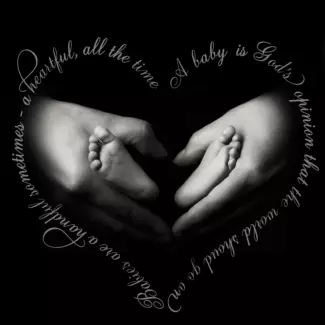 father's hands hold baby's feet surrounded by text art.