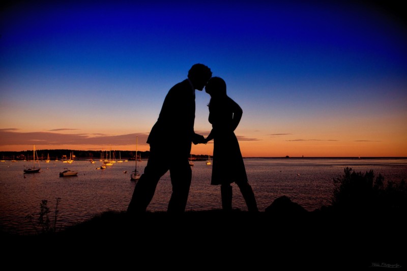 engaged couple at marina at sunset