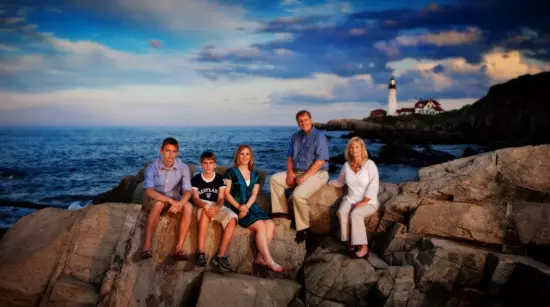 family portrait at maine coast on rocks by professional photographers