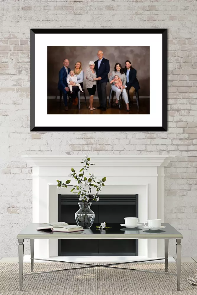 family portrait hanging over fireplace