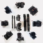 cameras with peak design anchors and straps, laid out in a circle