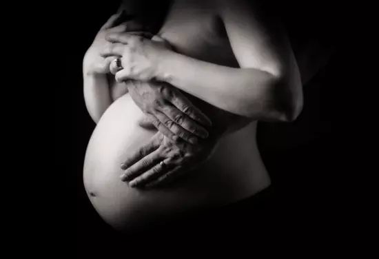 black and white pregnant belly pictures at maternity photography studio in maine.