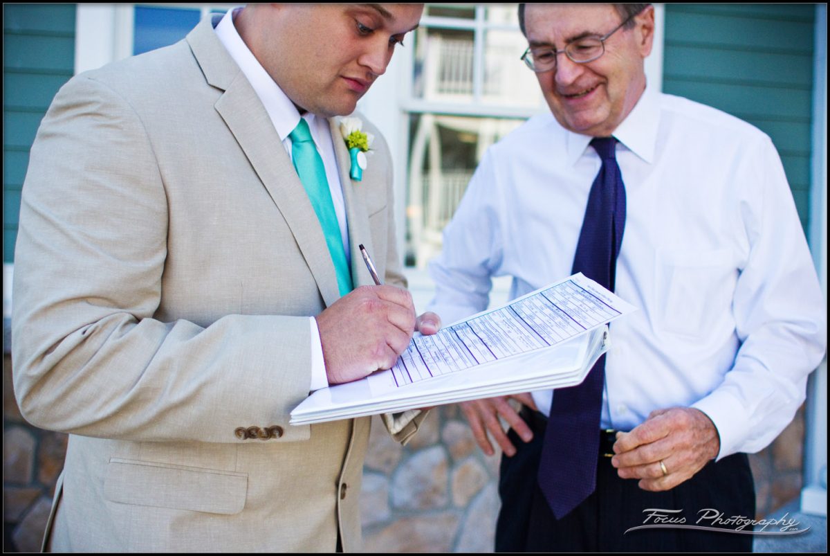 The best man signs the wedding license