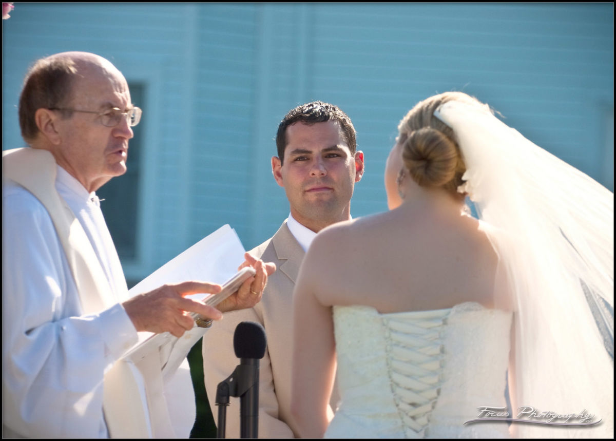 wedding vows being read at York Beach wedding in Maine