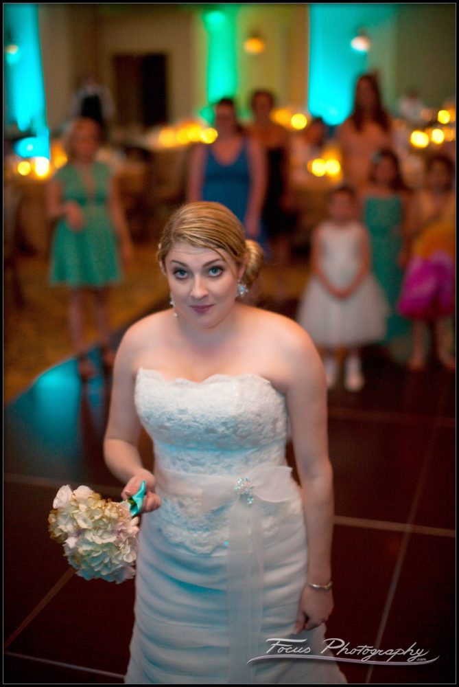 the bride tosses her wedding bouquet