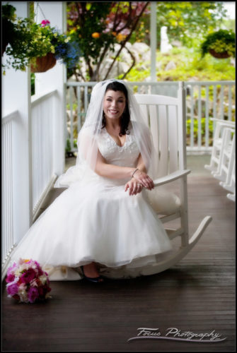The bride on the front porch of the Nonantum resort - Kennebunkport, Maine.