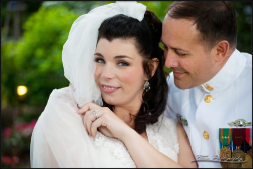 Devon smiles as Chris stays close to her during wedding photography