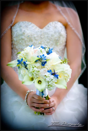 the bride holds her wedding bouquet