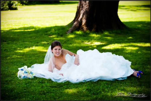 Kaitlin on the grass at maine wedding - photographers Will and Lucia of Focus Photography