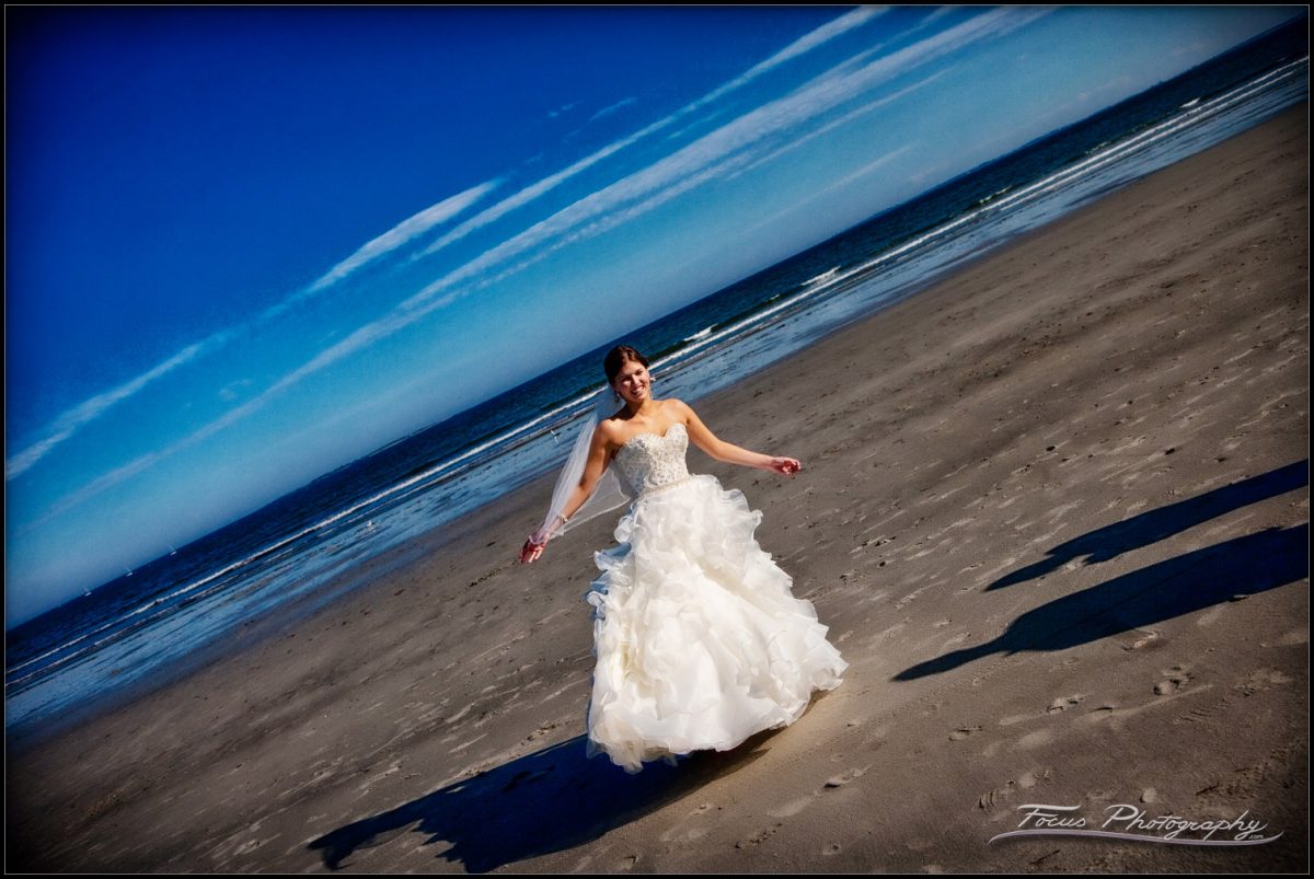 the bride on the beach in Scarborough, Maine wedding - photographers will and lucia of Focus