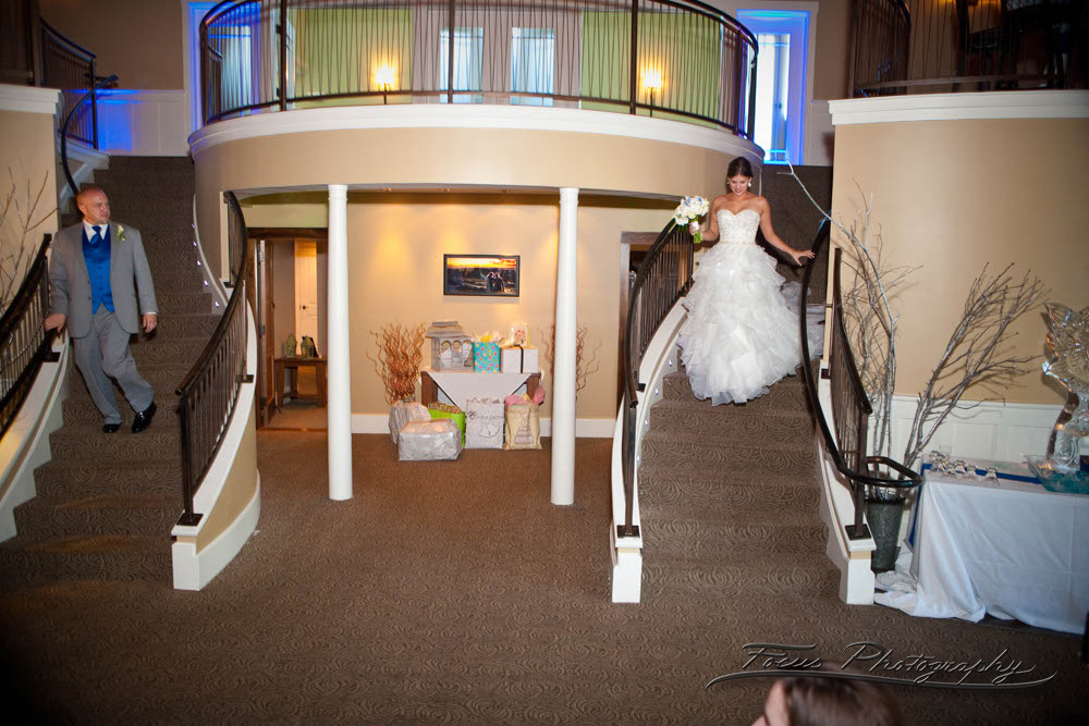 the bride and groom make their entrance at the Landing.