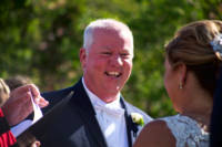Groom laughs during ceremony