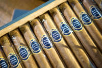Cigars with custom labels for wedding gifts.
