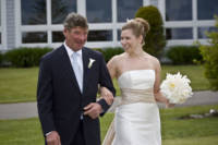 bride walks down aisle with father
