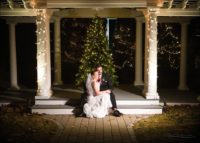 couple at Christmas tree at Village by the Sea wedding in Wells, Maine