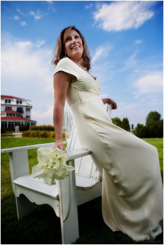 bride sits on adirondack chair