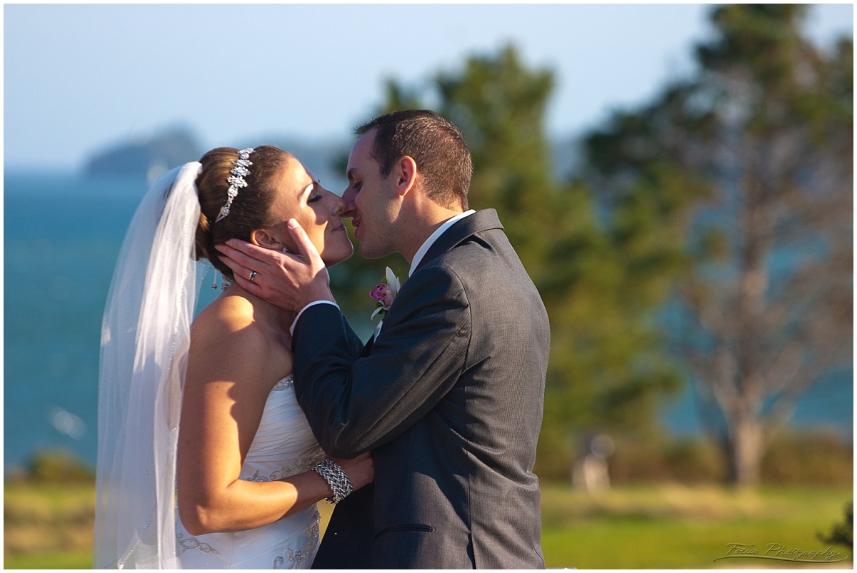 couple kiss at altar at Samoset resort wedding in Maine