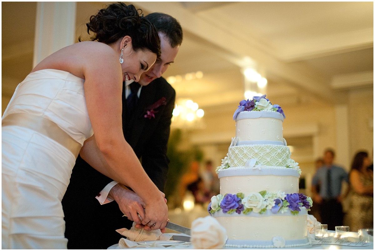 cutting the wedding cake at nonantum resort