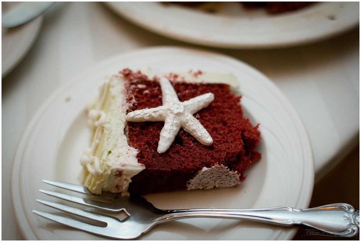 slice of wedding cake with starfish topping