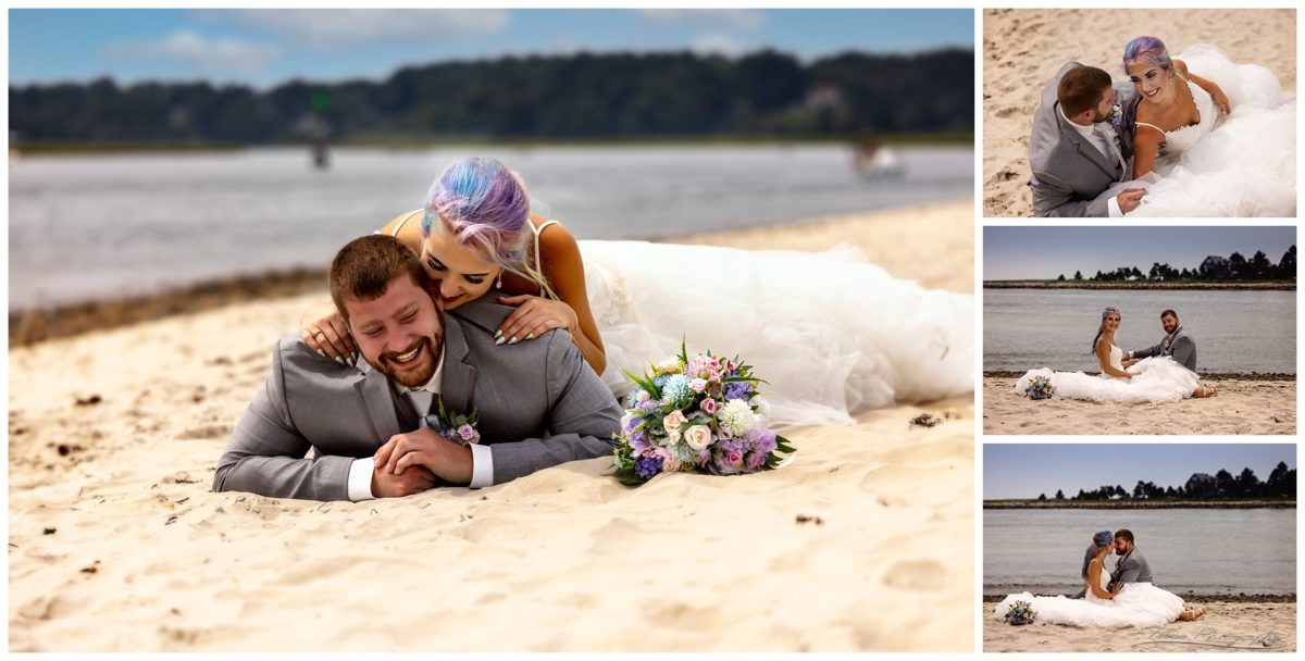 wedding couple laying on sand at Drake's Island