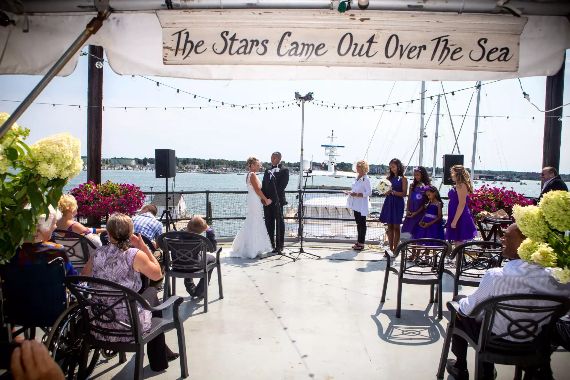 wedding ceremony on dimillos restaurant's outdoor deck in portland, maine