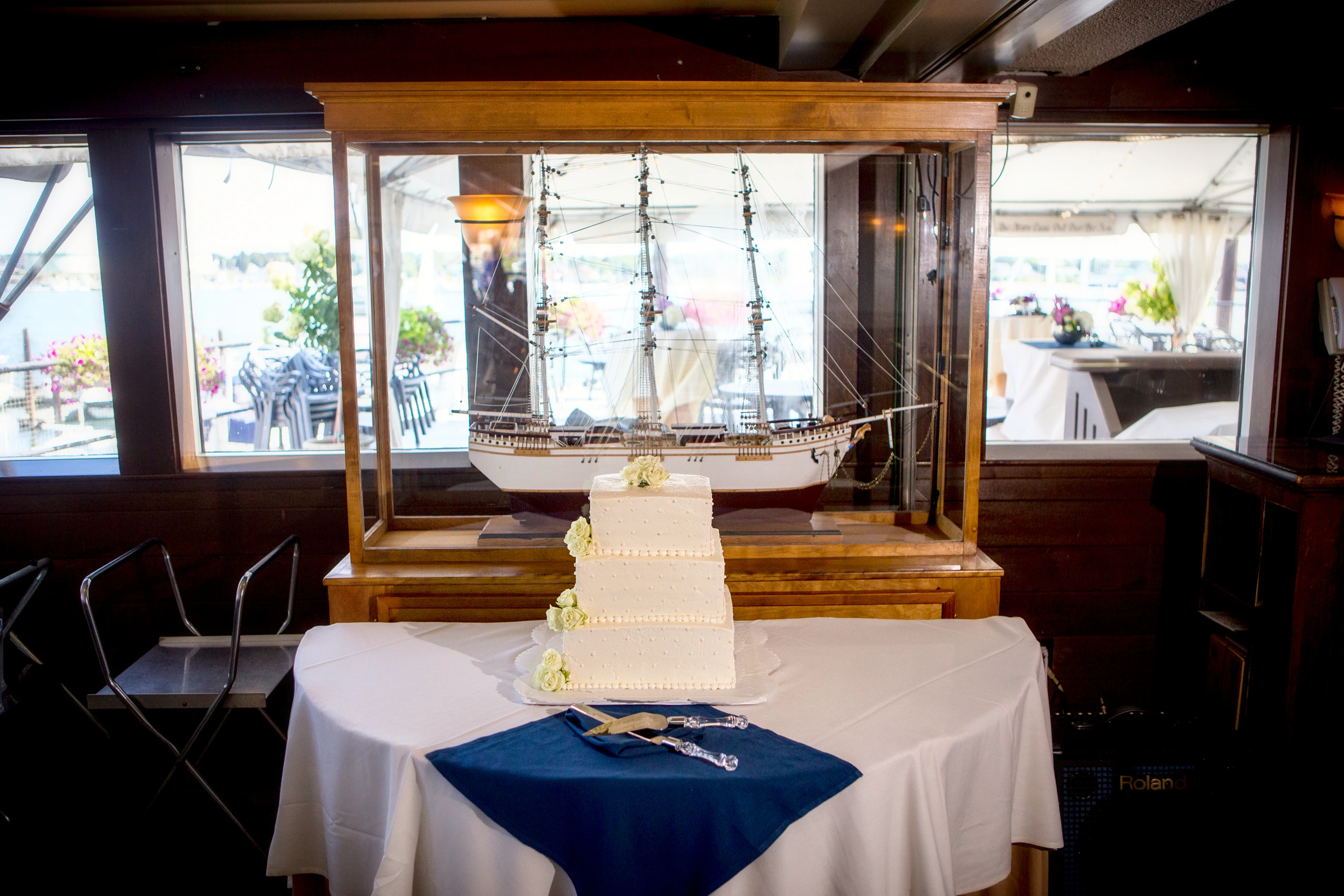 wedding cake and model boat inside dimillos floating boat
