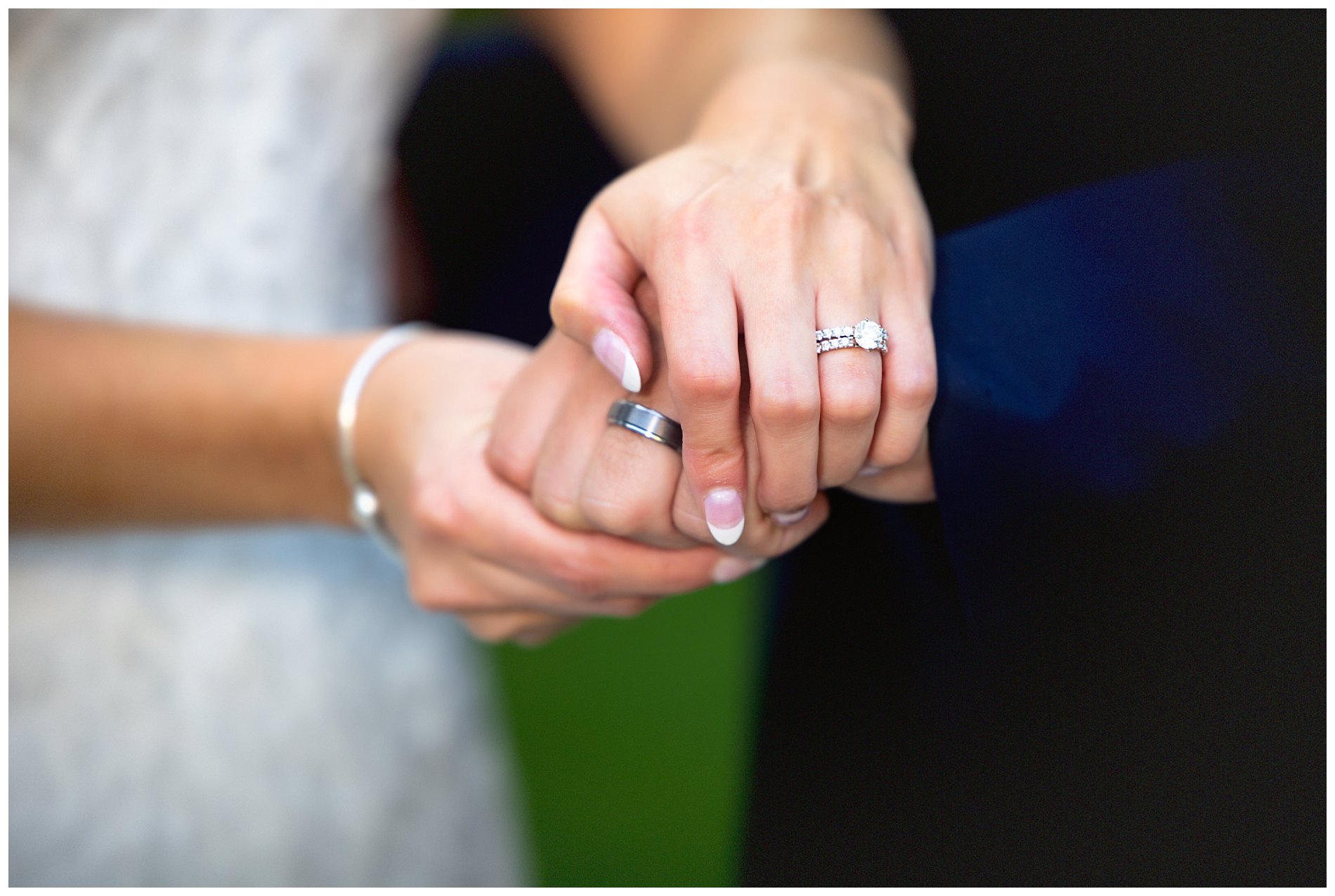 wedding rings on couple's hands after ceremony