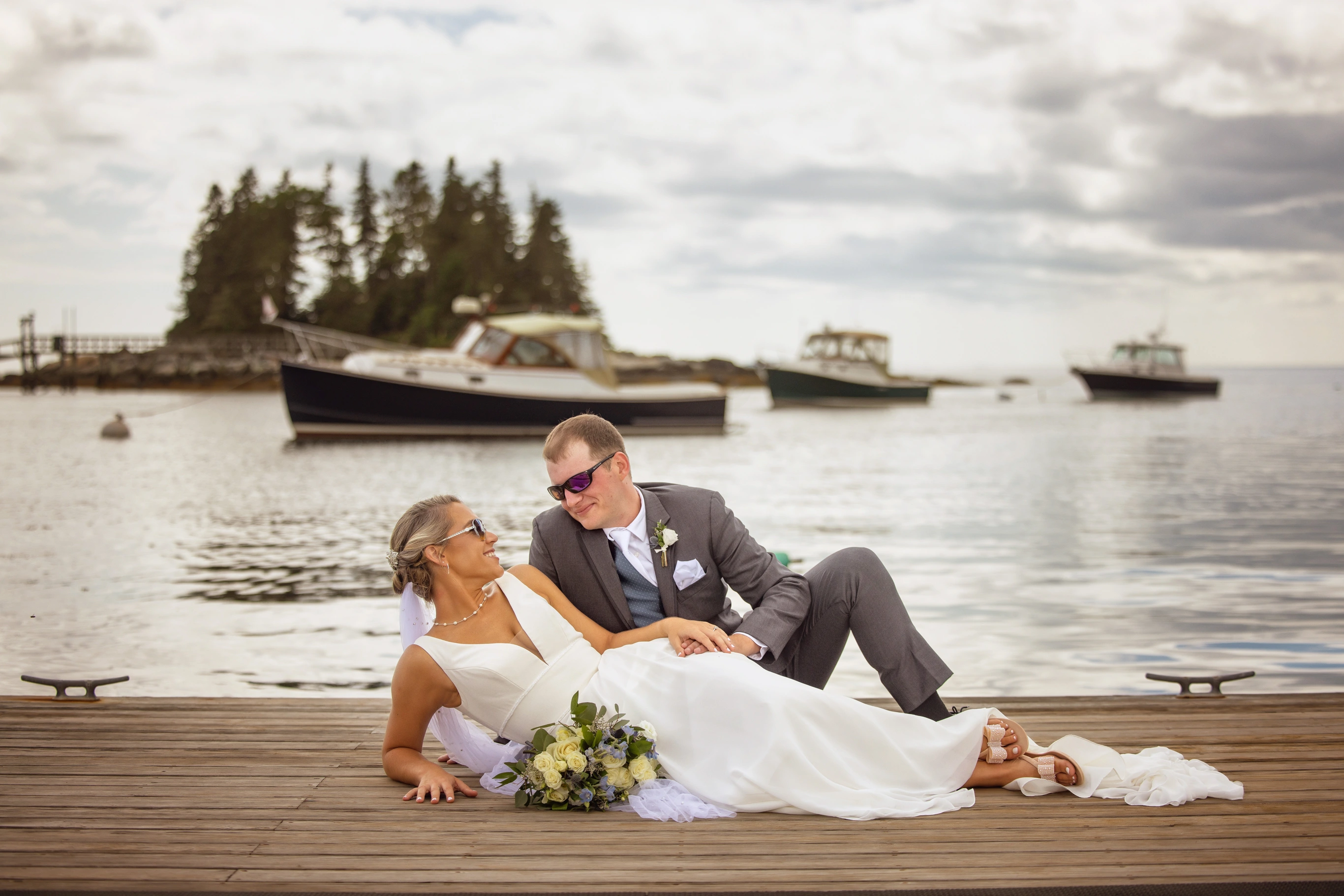 wedding couple at docks of Newagen Seaside Inn wedding photographed in the midcoast of Maine