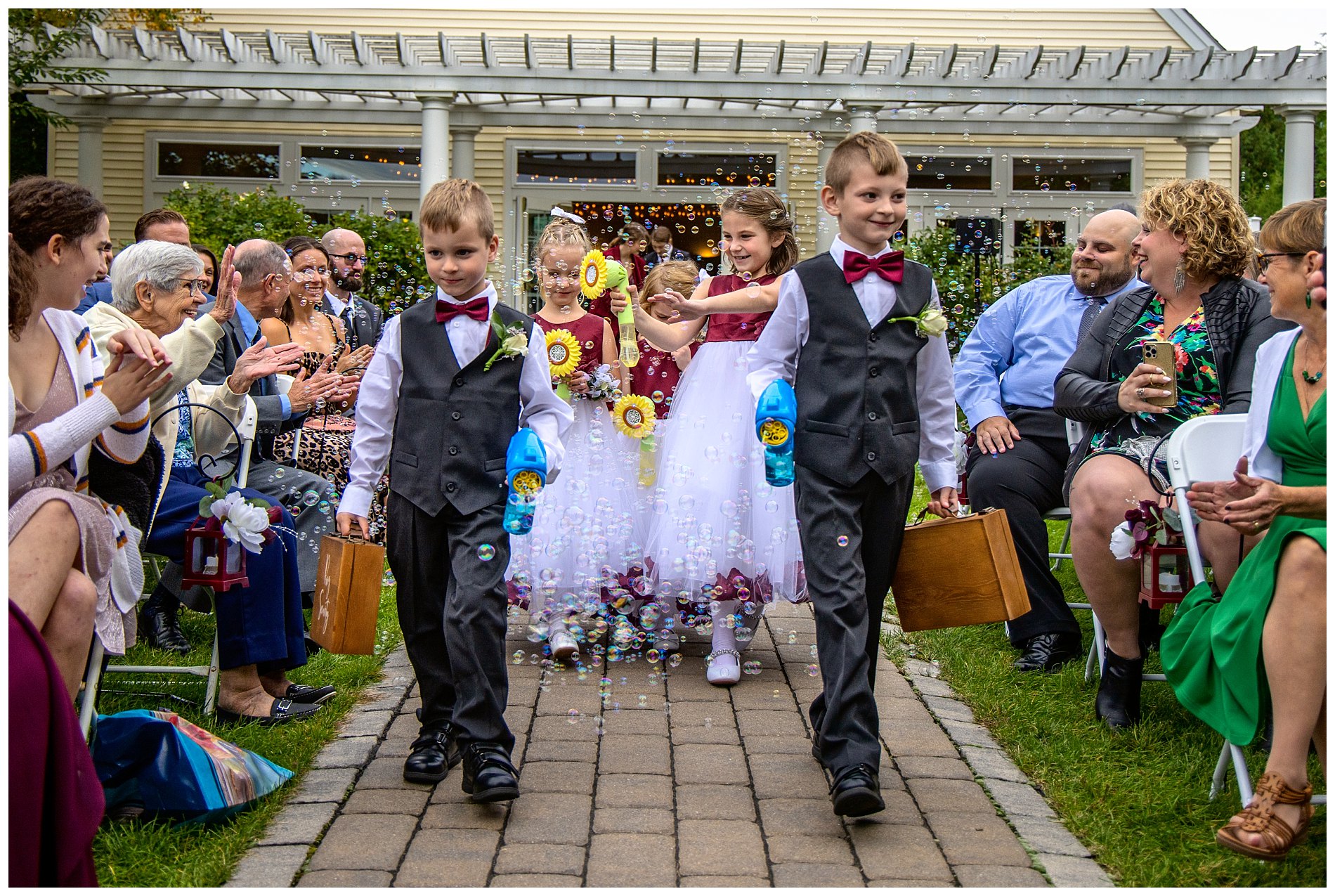 bubbles blown by ring-bearers and flower girls start wedding procession
