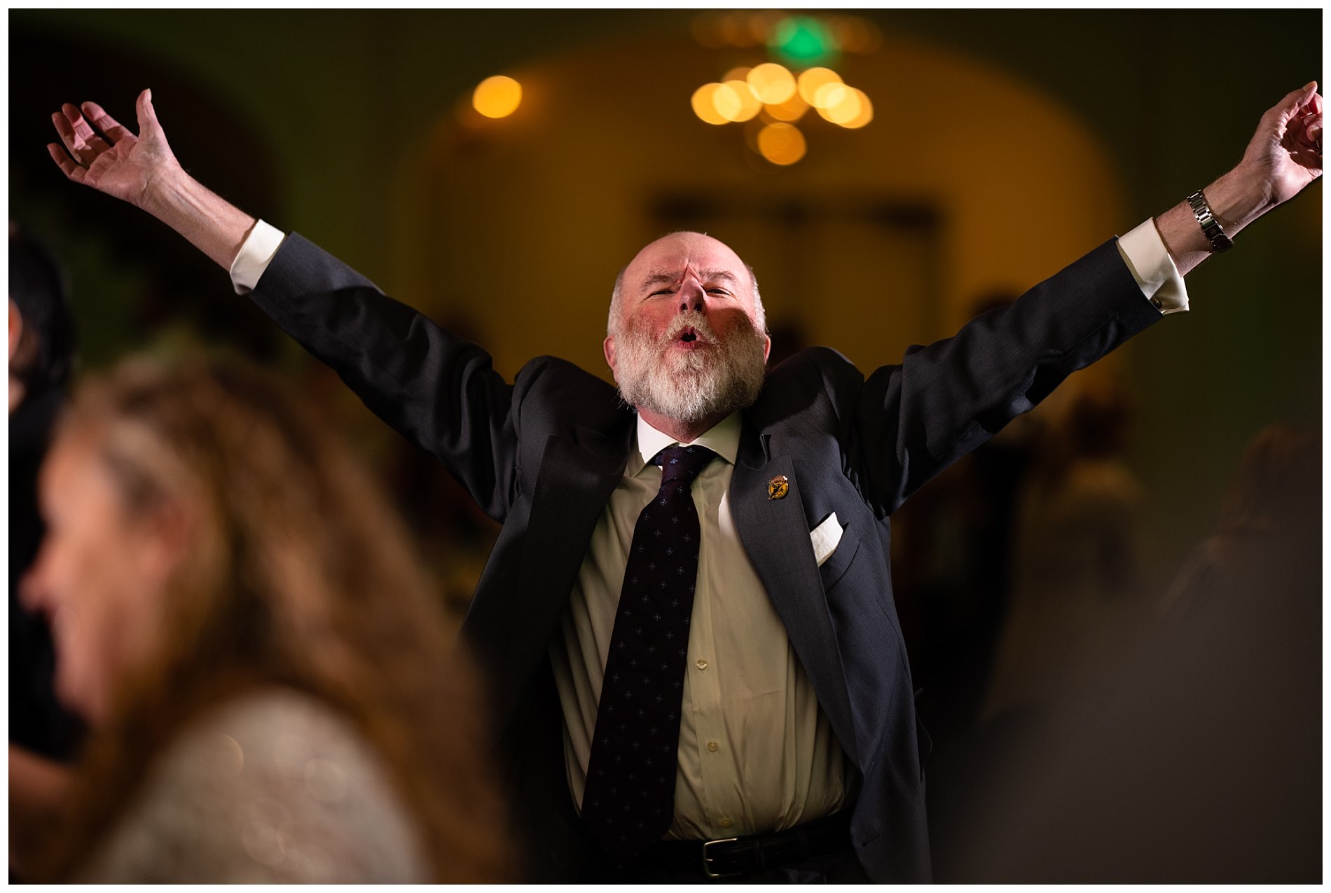 uncle celebrates on dance floor at wedding
