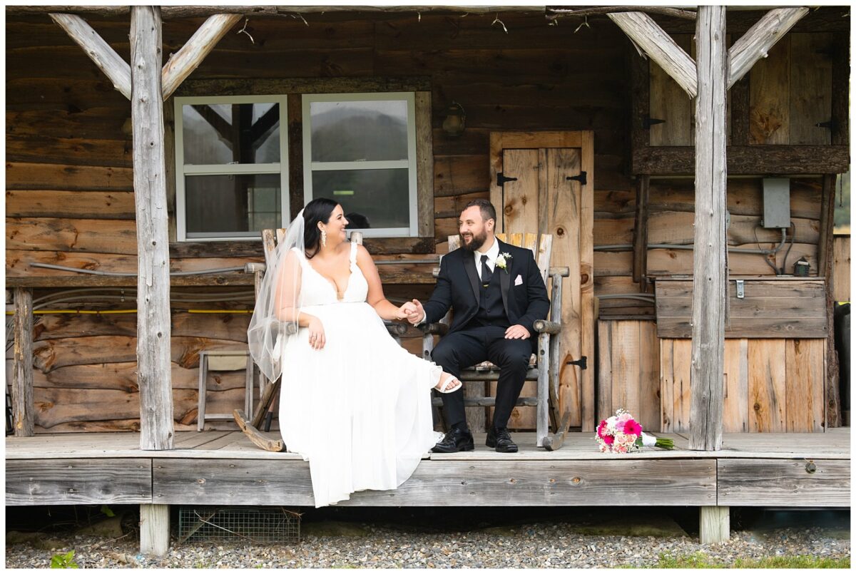 wedding couple on front porch of old cabil