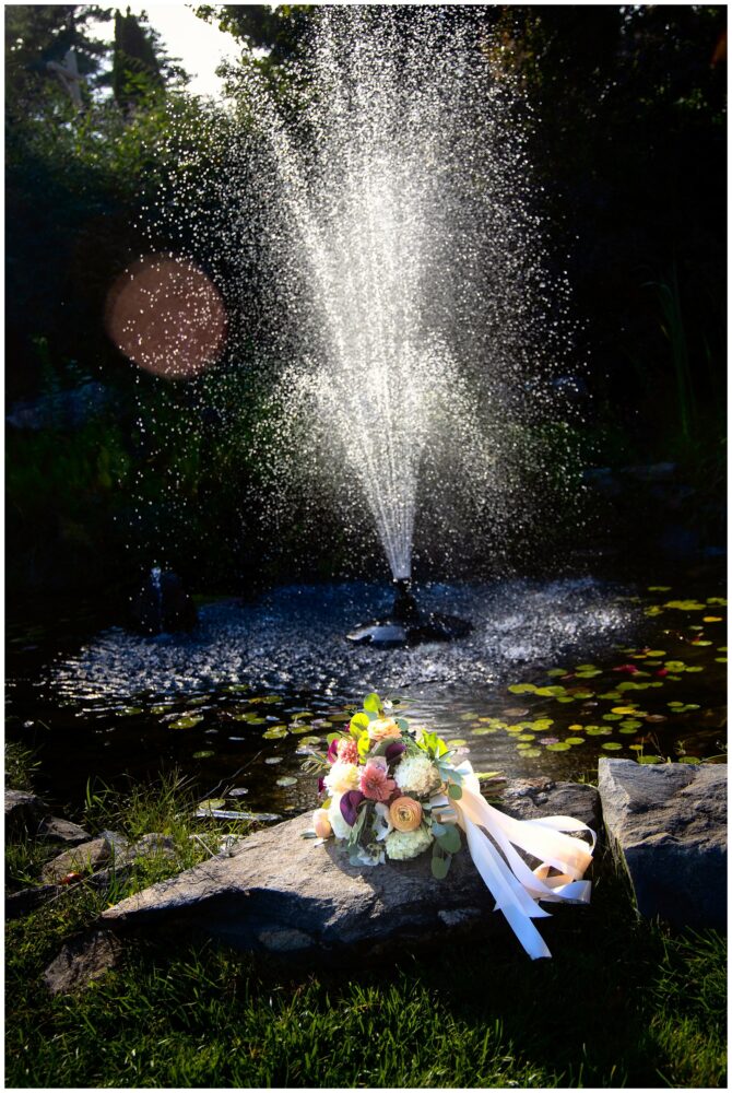 Wedding bouquet in front of fountain