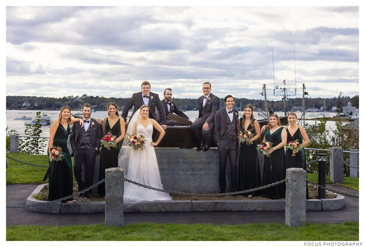 the wedding party on a statue