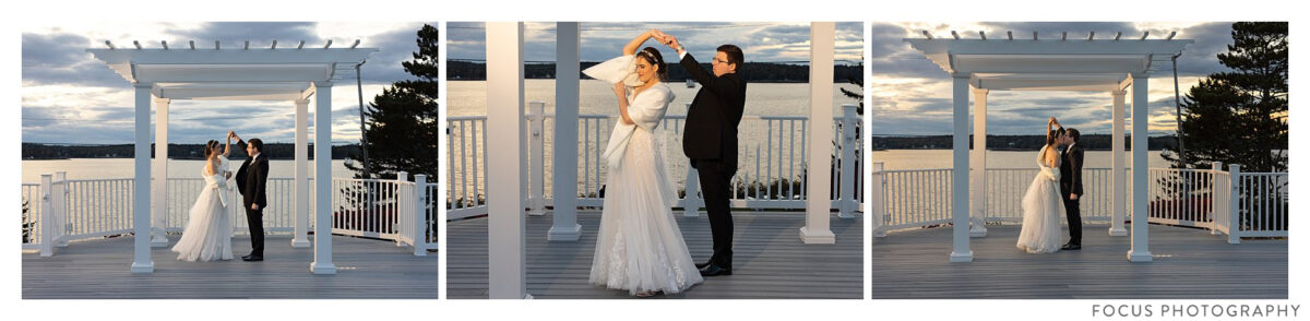 wedding couple practices dance moves in front of boothbay harbor