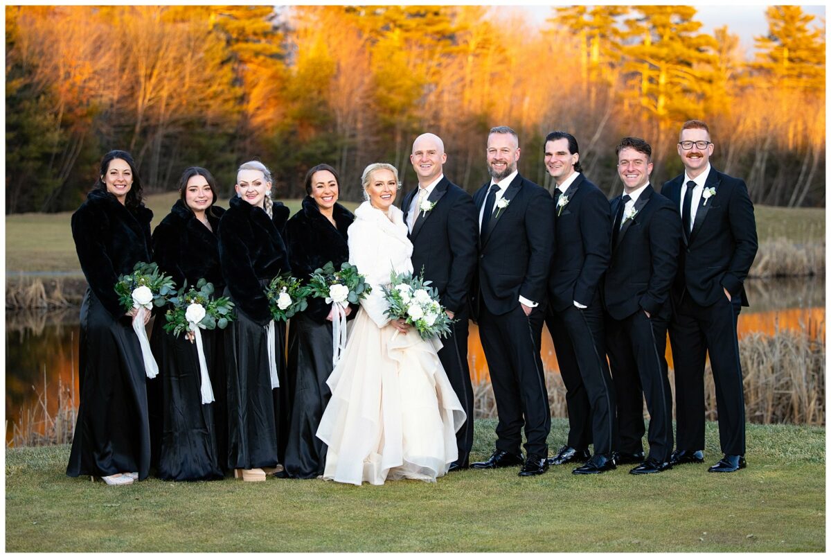 the entire wedding party together for a formal portrait at wells, maine wedding