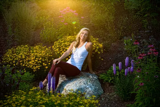 senior pictures in the flower gardens at fort williams for yearbook pictures in maine