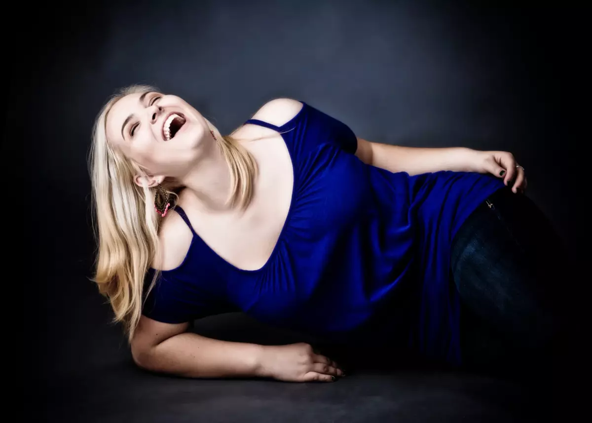 girl laughing in photograph studio for senior pictures maine