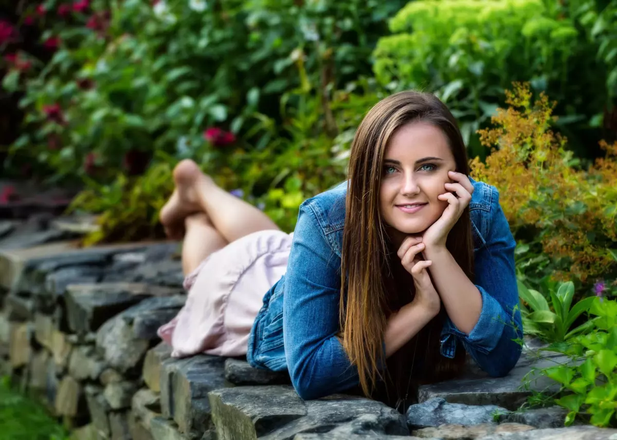 gorham high school senior pictures of girl photographed on stone wall at house in maine