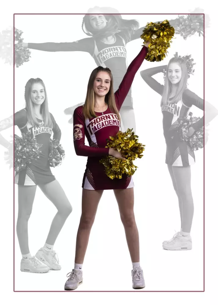 high school cheerleader photographed in studio for senior pictures