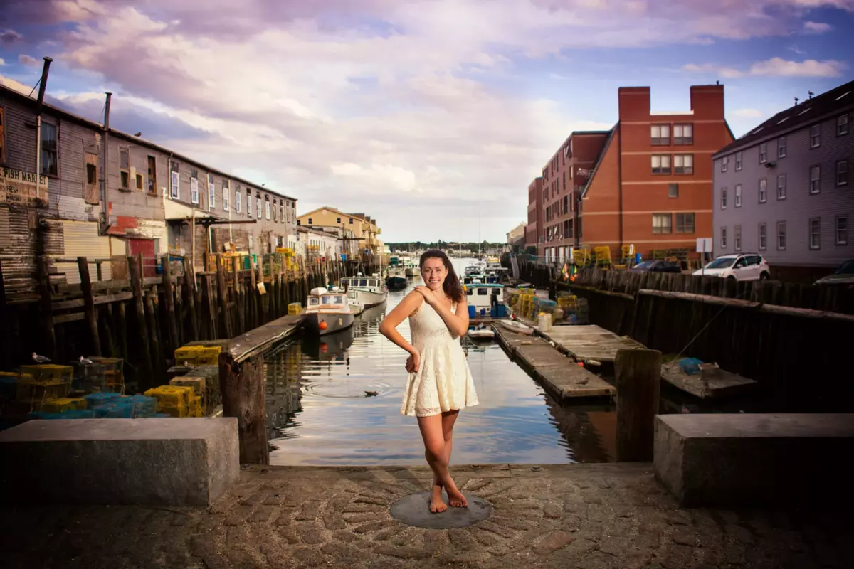 high school girl photographed for graduation senior pictures at portland maine waterfront