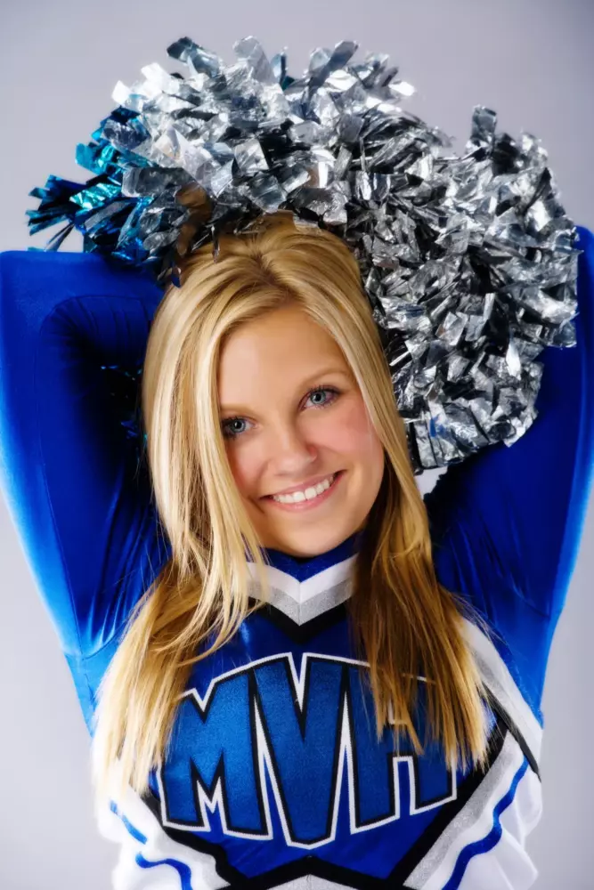 mountain valley high school senior picture of cheerleader in uniform at photography studio in maine