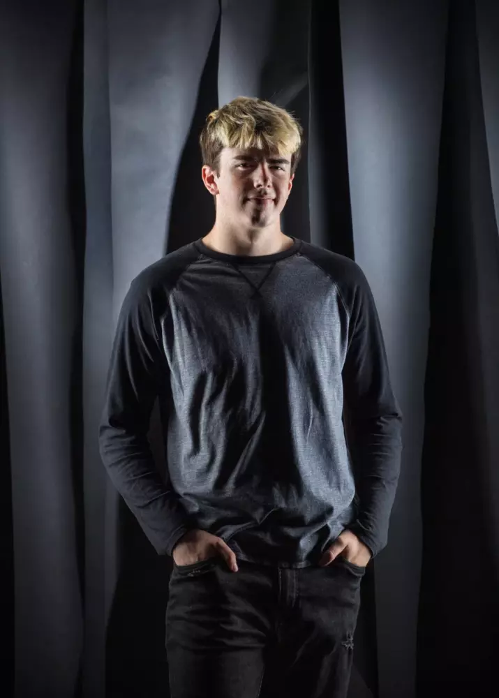senior boy from maine high school in studio for graduation pictures