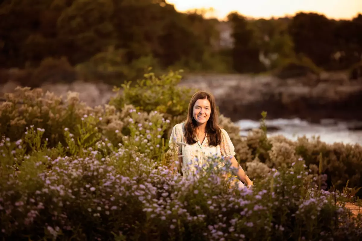 senior girl photographed in wildflowers park in maine