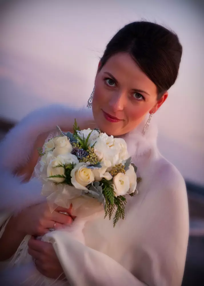 Bride in winter fur maine wedding
