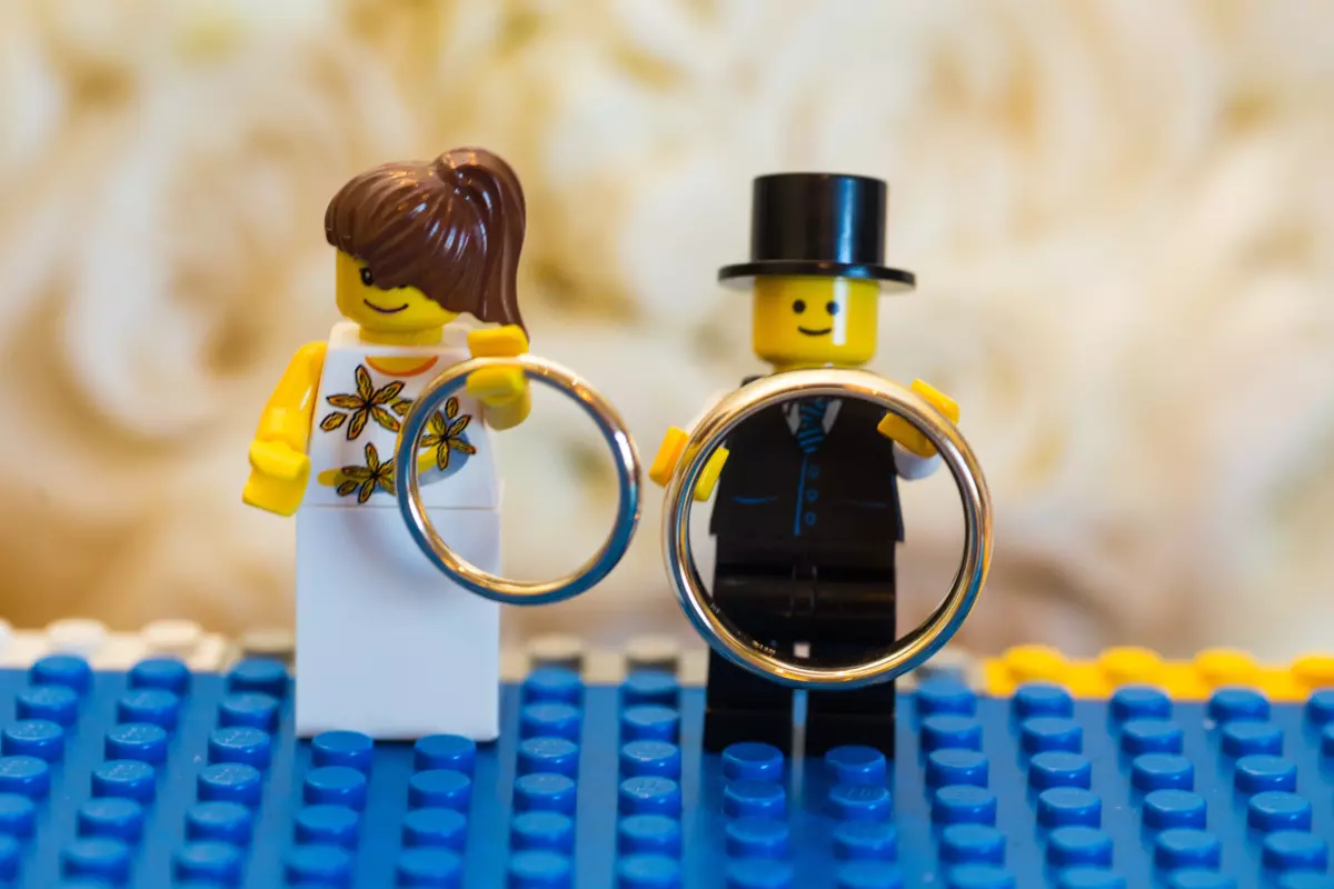 Lego bride groom hold wedding rings