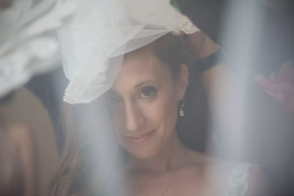 Bride photographed through veil