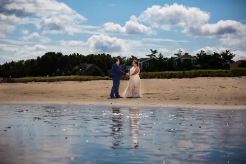 bride and groom on the beach photo in review of maine wedding photographers focus photography