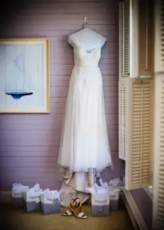 wedding dress hanging in the bride's room