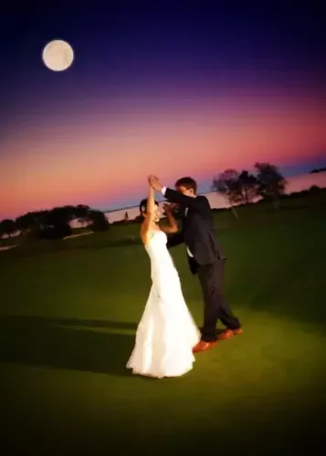 Bride and groom dance on green lawn at Samoset Resort under sunset sky. Perfect for Maine weddings. Professional wedding photography in Maine. 